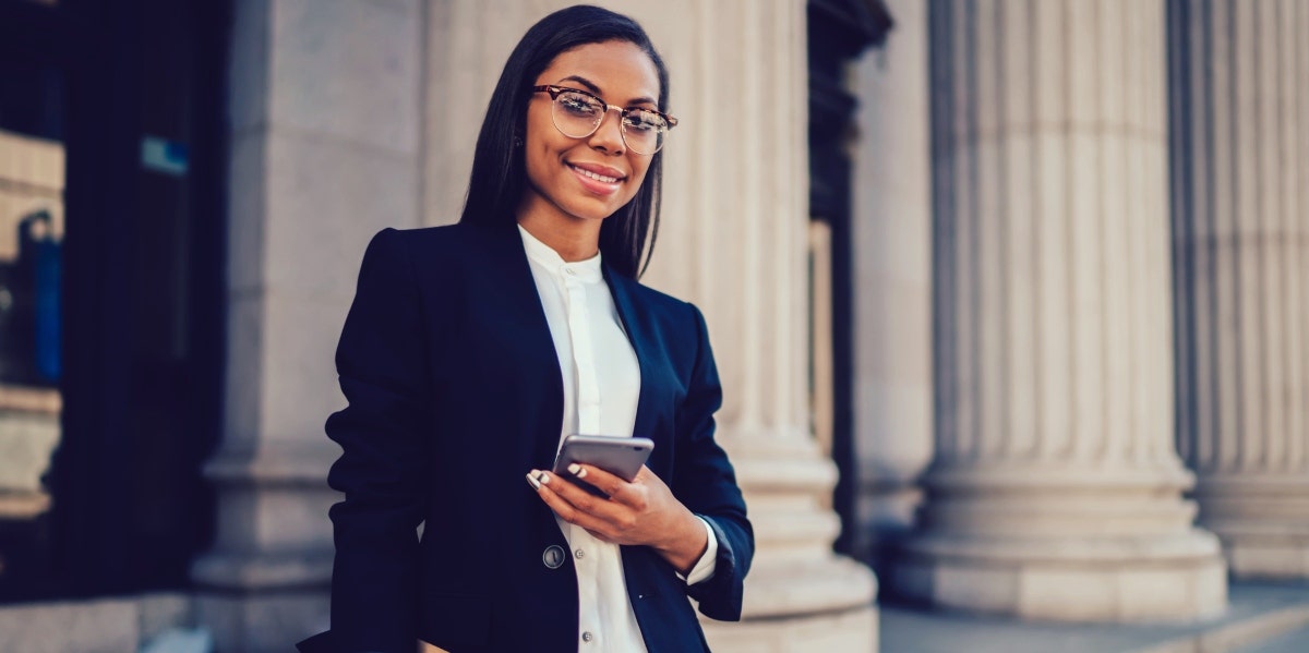 professional woman holding smartphone