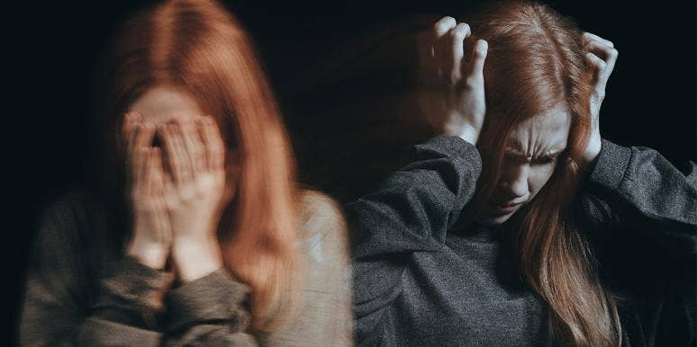 woman covering eyes with red hair