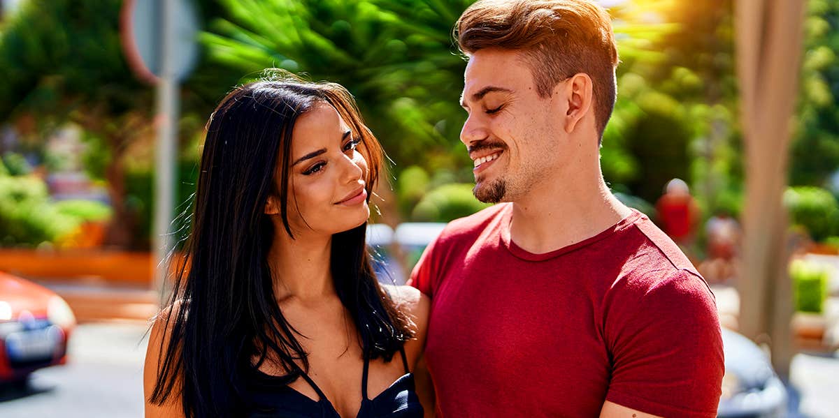 couple standing outside in street