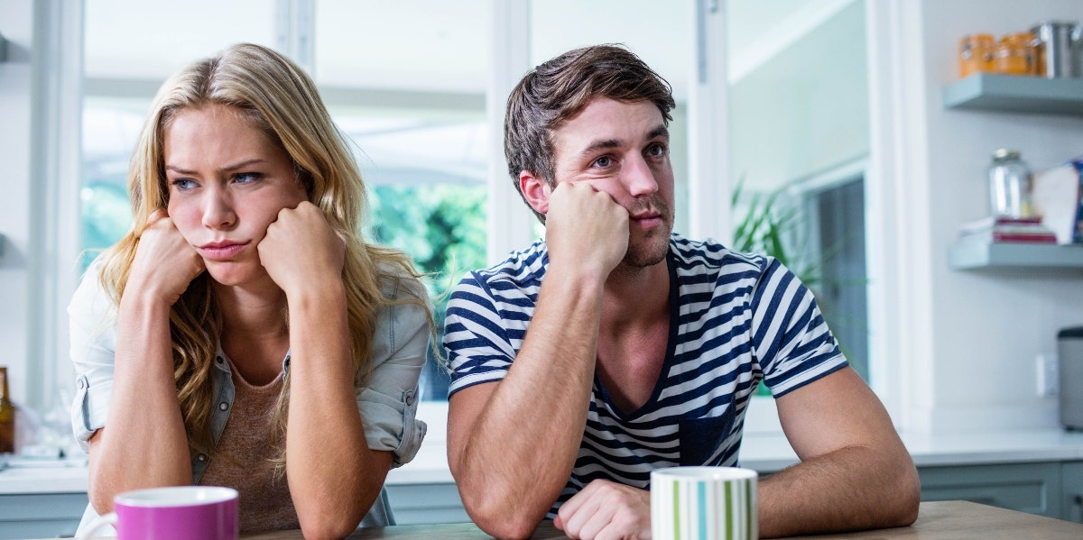 annoyed couple ignoring each other