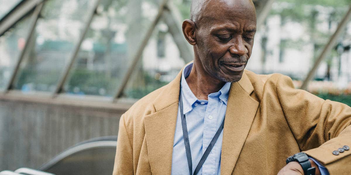Boss Tells Employee That Working Overtime 'Isn't Really Optional' So Employee Stands Up For Commitments Outside Work man looking at his watch