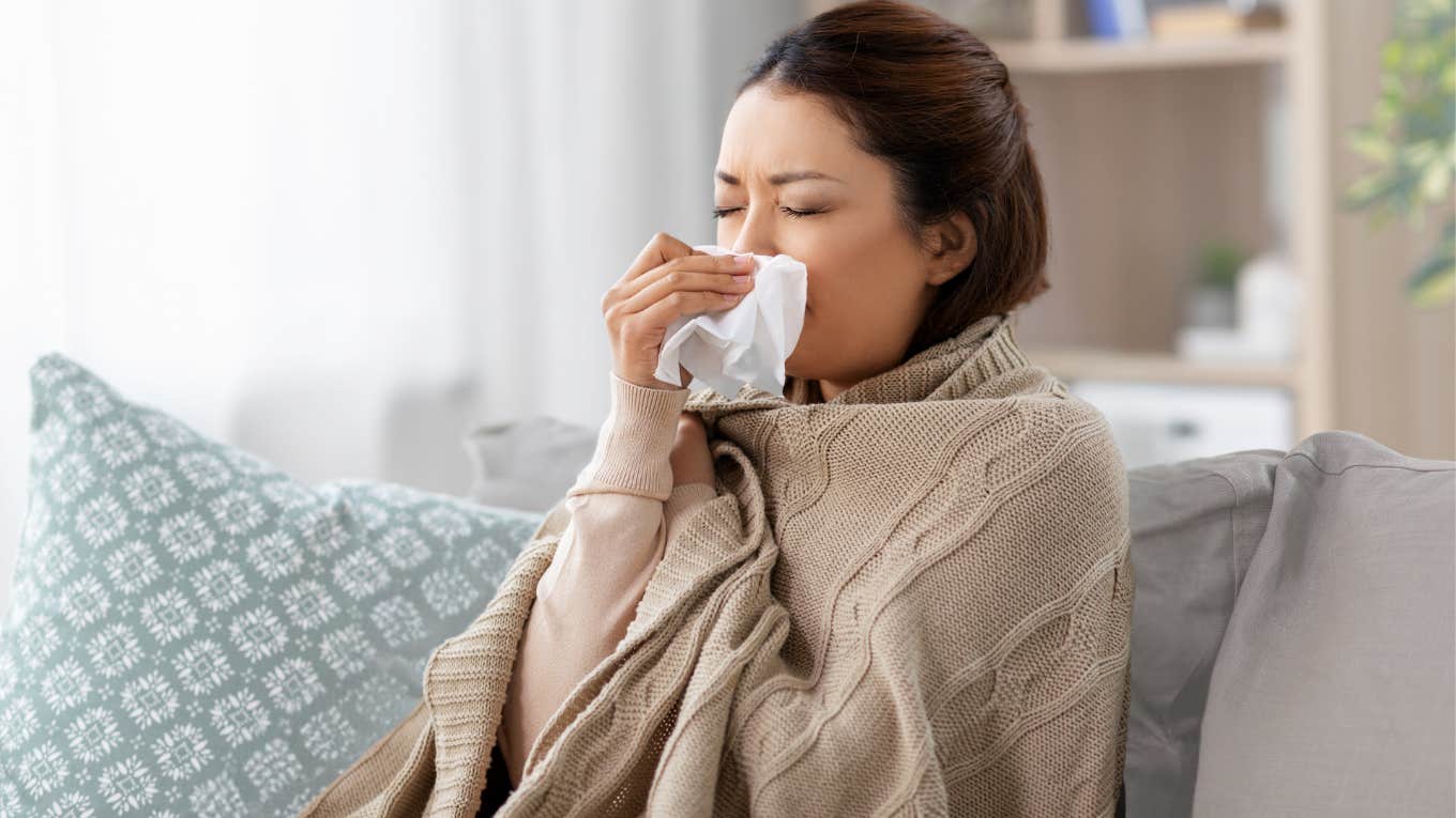 Sick employee sitting at home on the couch. 