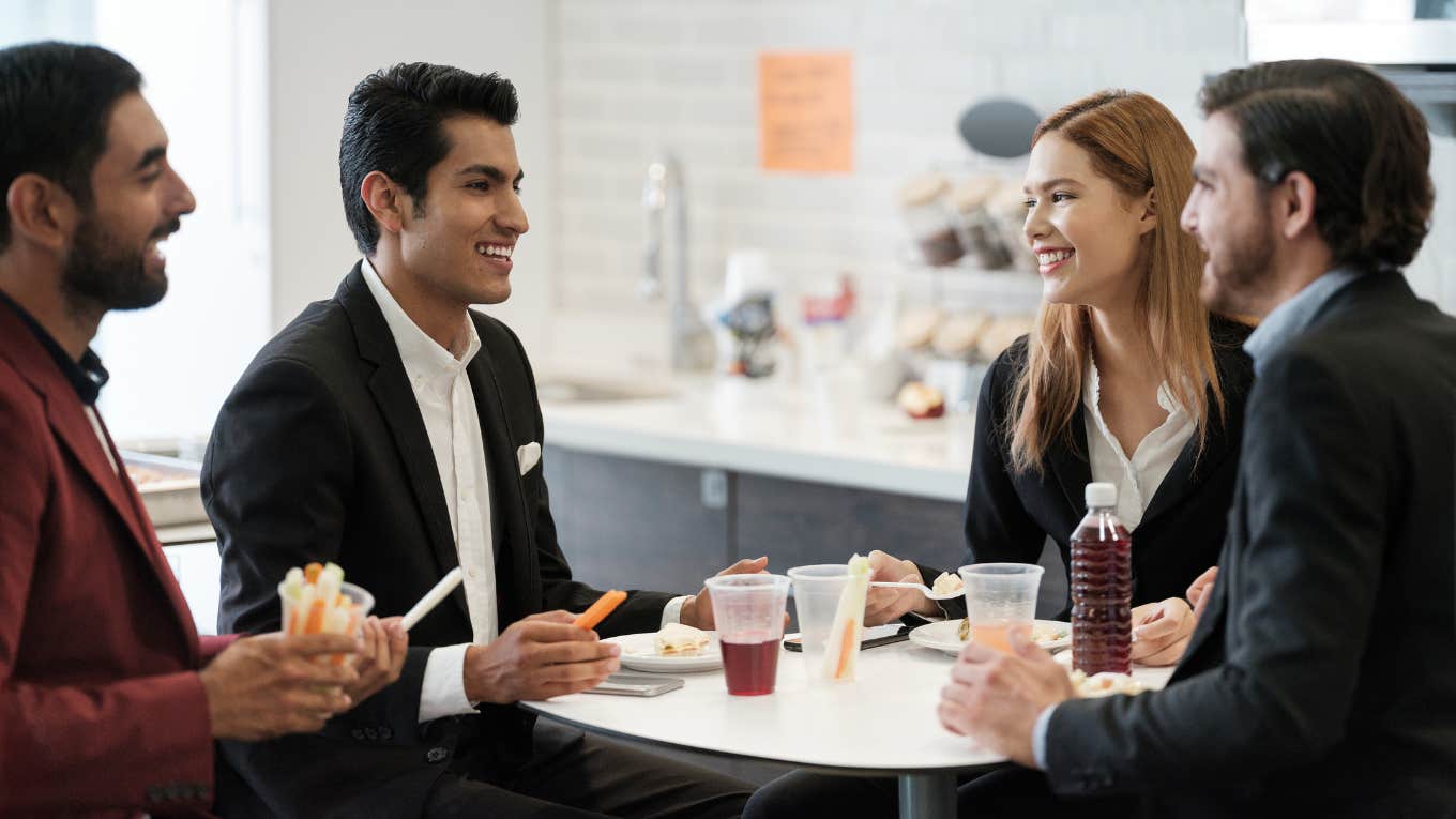 Coworkers eating together on their lunch break. 