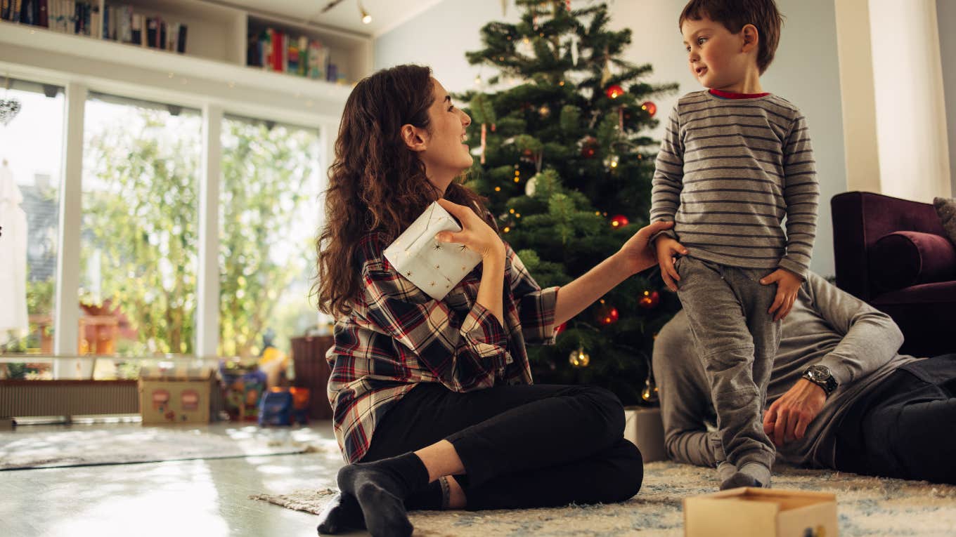 little boy giving mom Christmas present