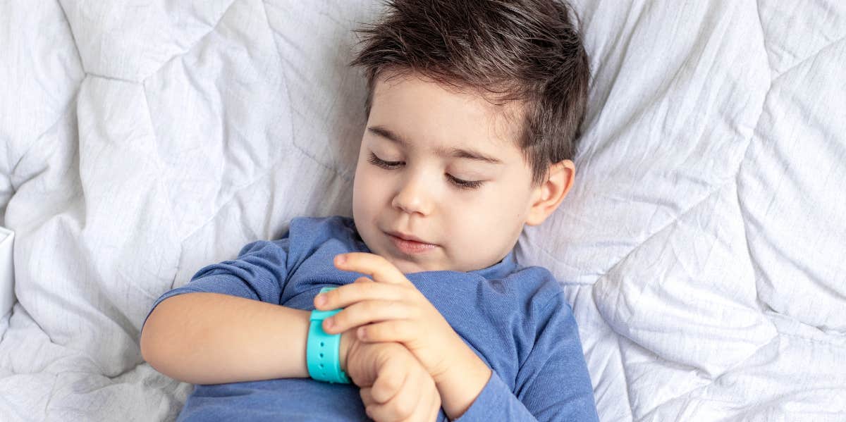 boy with smartwatch listening device