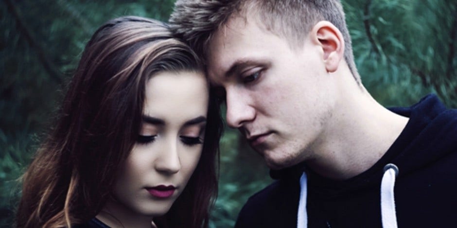 Undeniable Hints You Should Leave Him (The Sooner, The Better) woman and man looking emo and touching foreheads