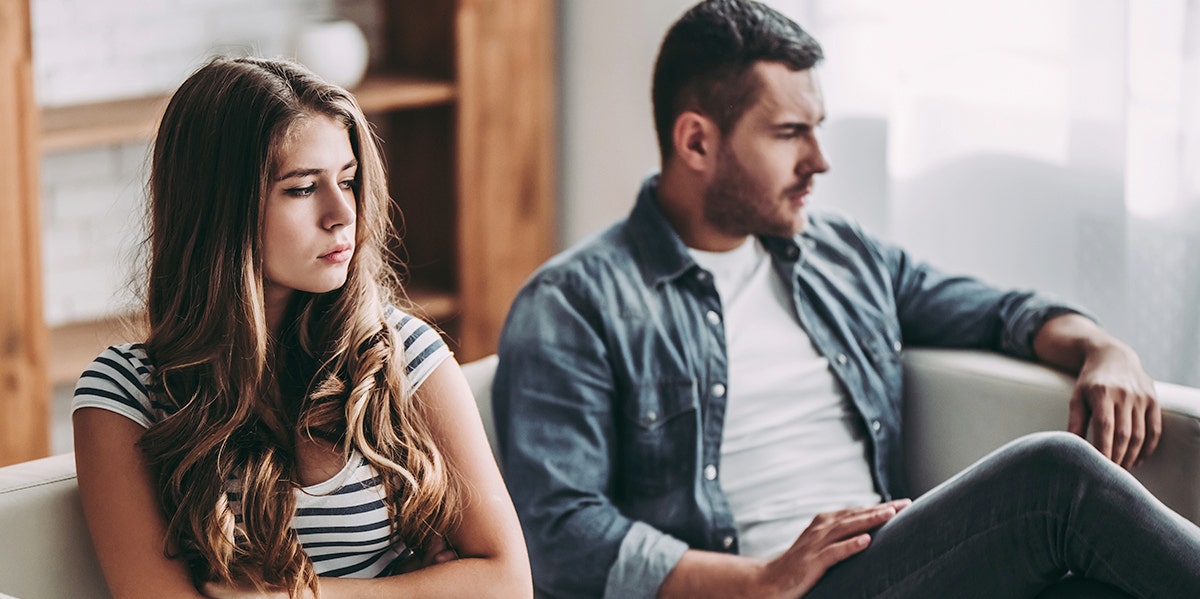 man and woman looking tense together