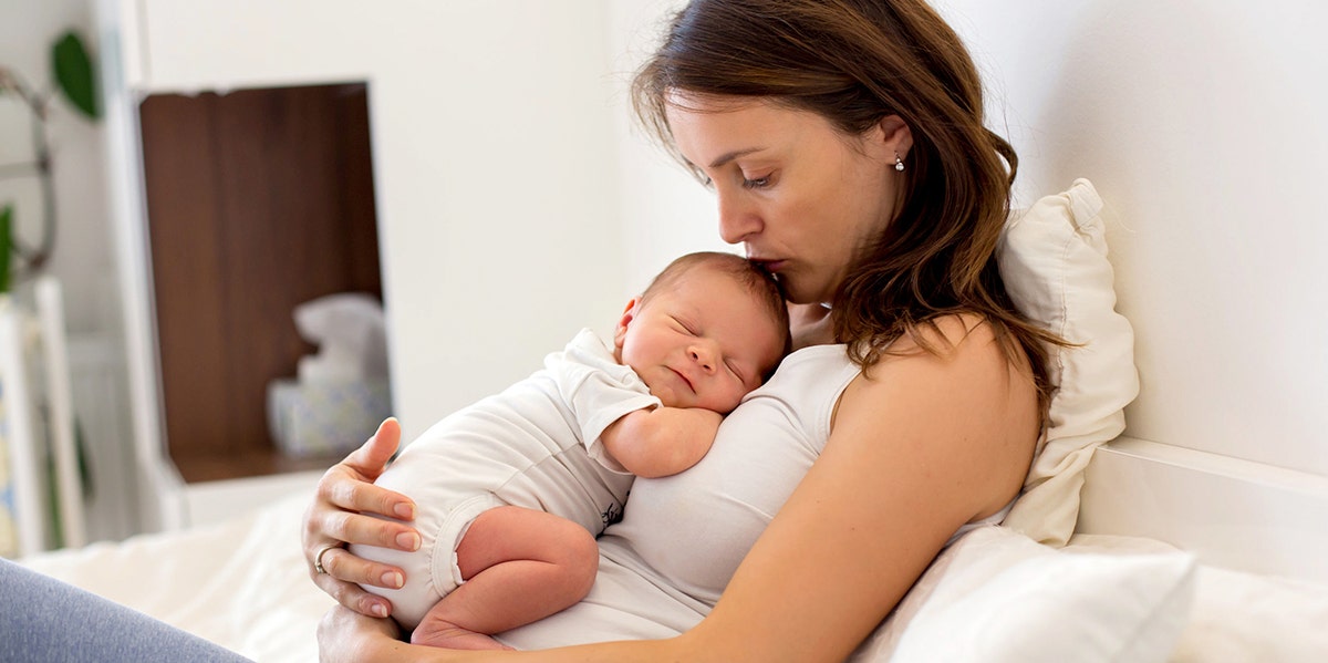 mom holding newborn baby