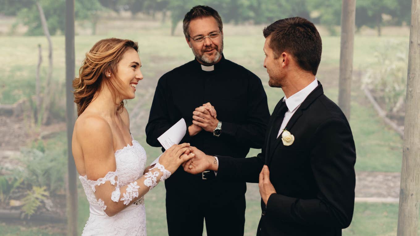 Bride and groom read their vows during a wedding. 