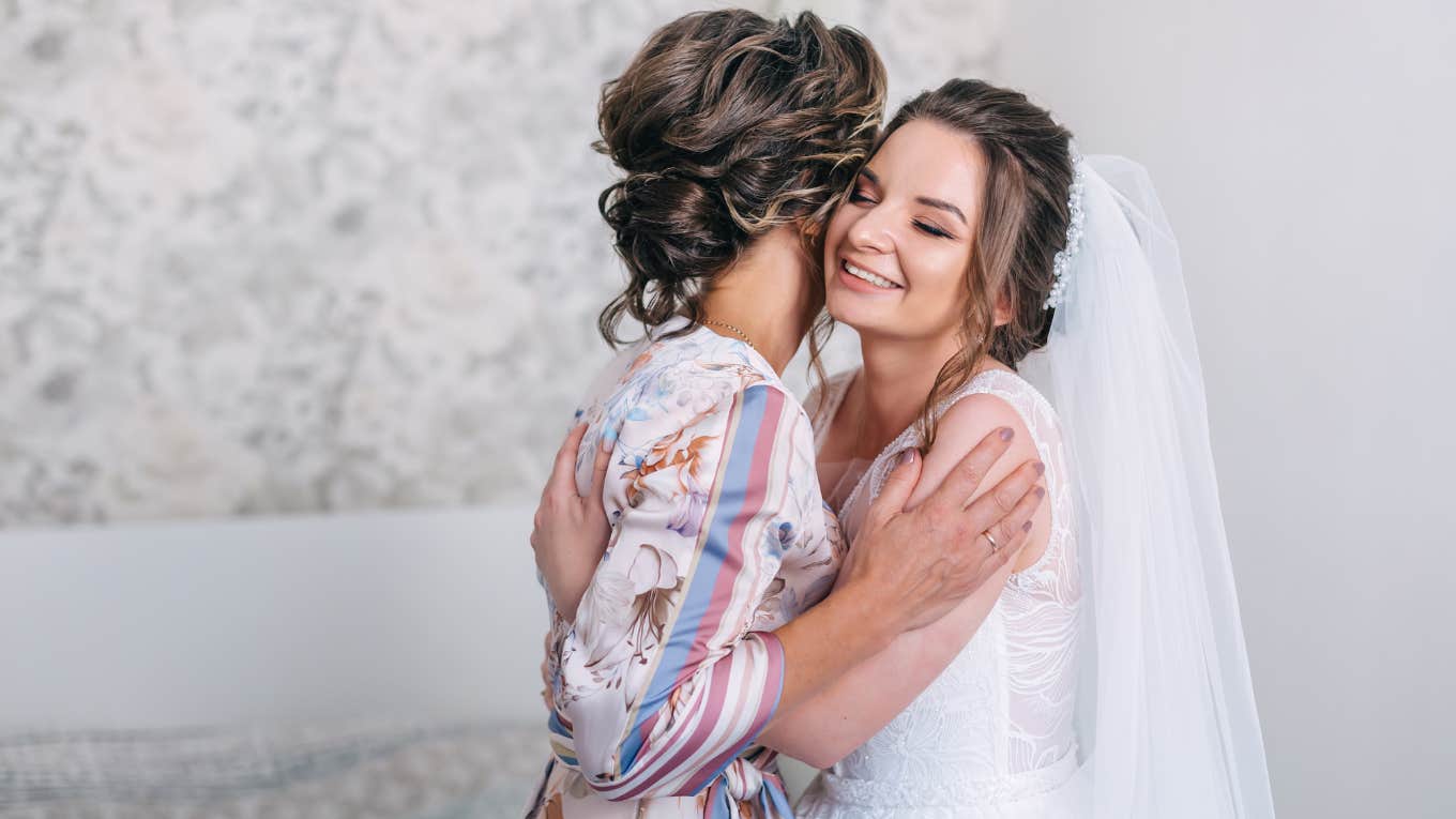 bride hugging her mother