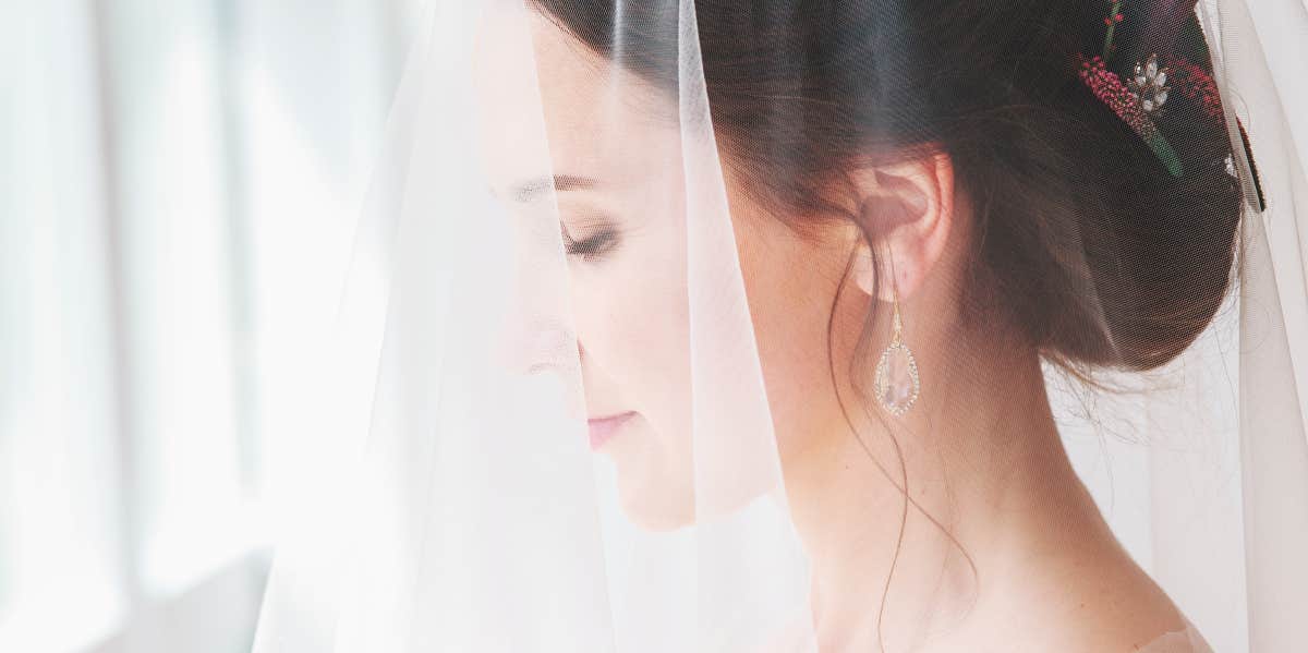 bride with veil over her face