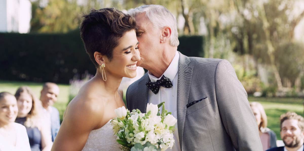 Bride Refused To Wait For Late Dad To Walk Her Down The Aisle dad kissing bride on cheek at wedding