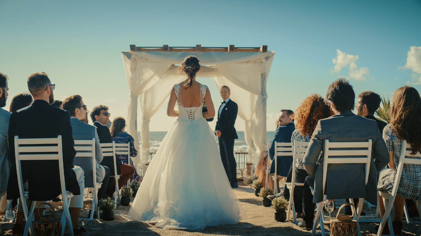 bride walking down the aisle to meet groom at altar