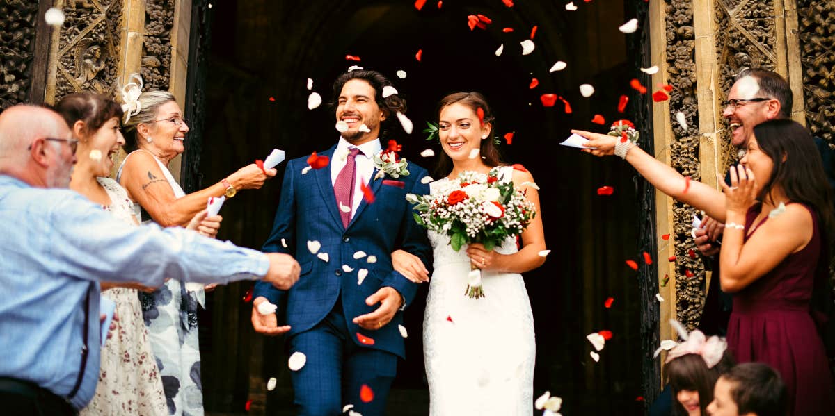 Bride and groom leaving church after wedding