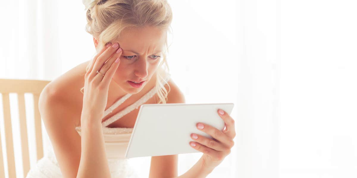Woman Says Husband's Ex Sent Her Their Sex Tape The Day Before Their Wedding Bride looking at tablet