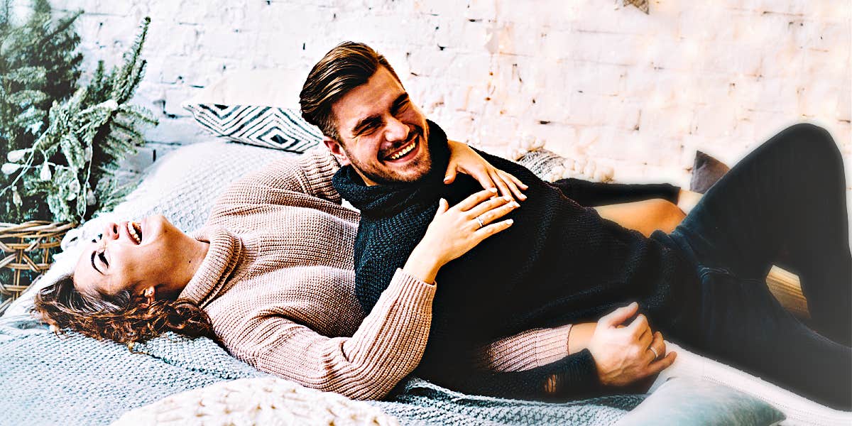 bring joy back to marriage man and woman laughing in bed, wearing sweaters