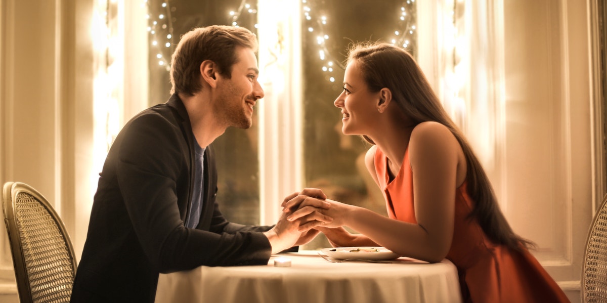 8 Super-Sweet (And Easy!) Ways To Bring Romance Back To Your Relationship woman and man having dinner