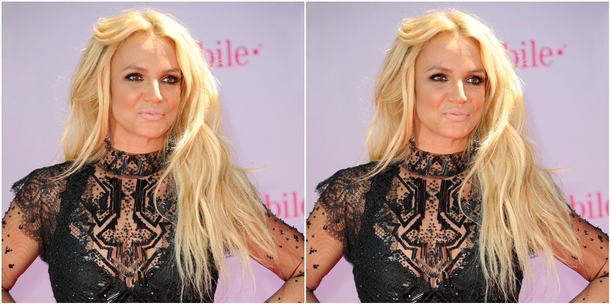 Britney Spears conservatorship Britney Spears posing in black lace dress on step & repeat