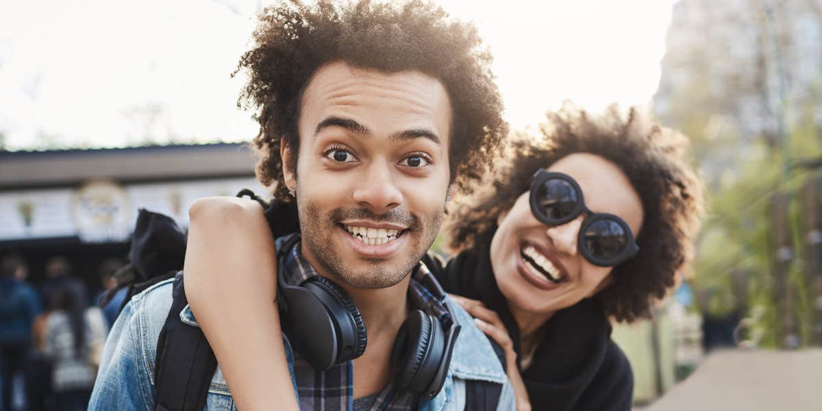 man and woman smiling for camera