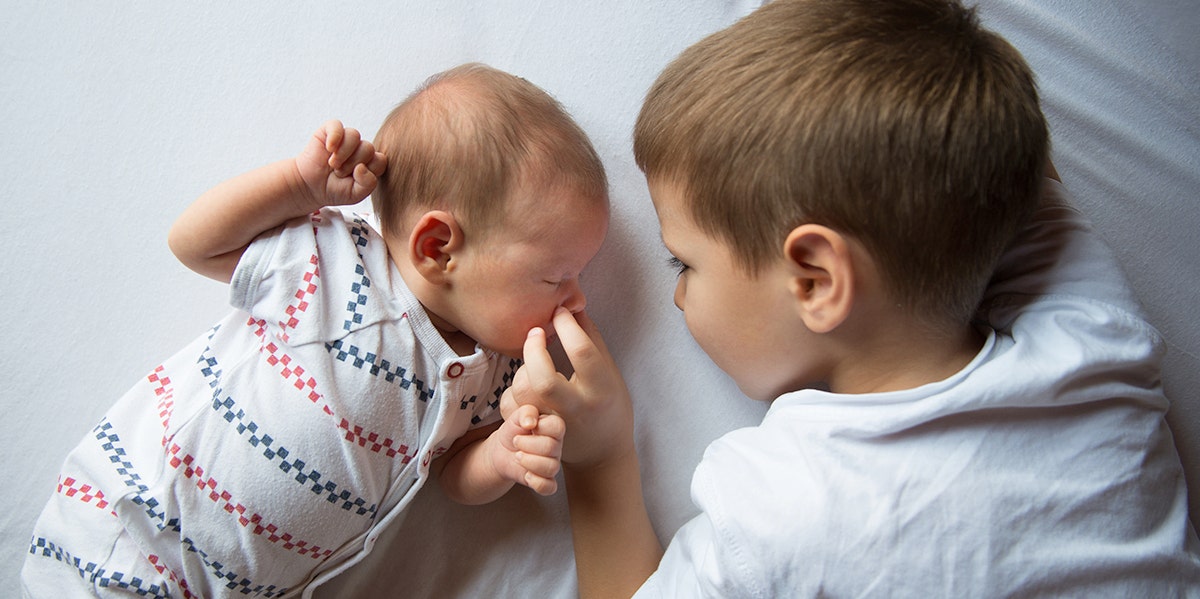 brother and newborn baby