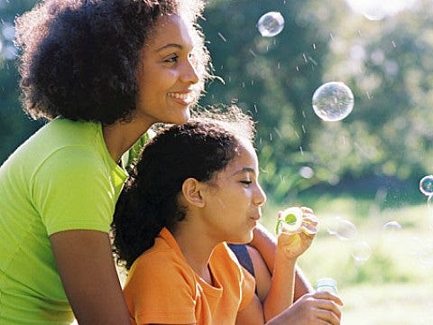 single mom and daughter with bubbles
