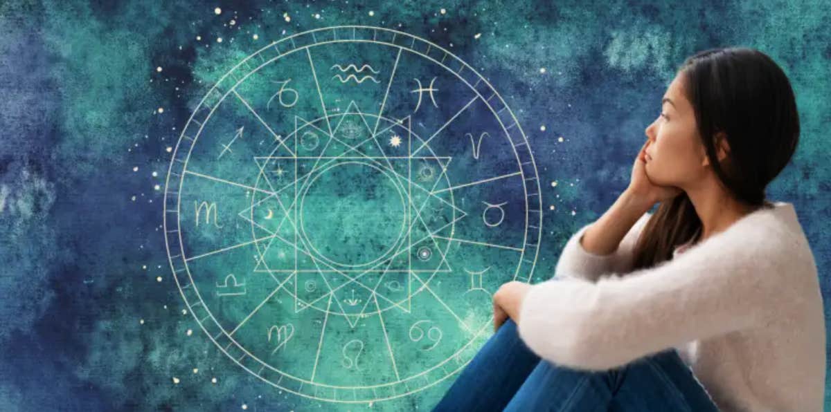 can astrology predict your life young woman pondering, a backdrop of an astrological chart