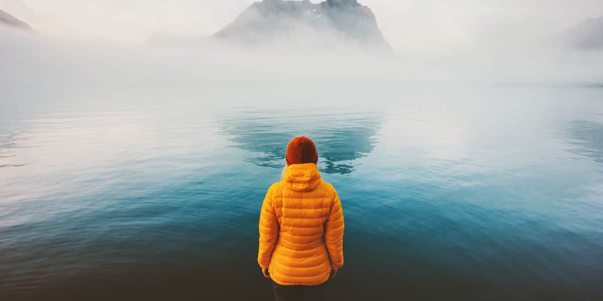 woman looking over lake