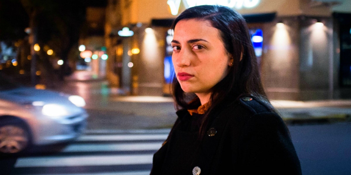 5 Negative Traits Of A Cancer Zodiac Sign women outside walking down the street at night