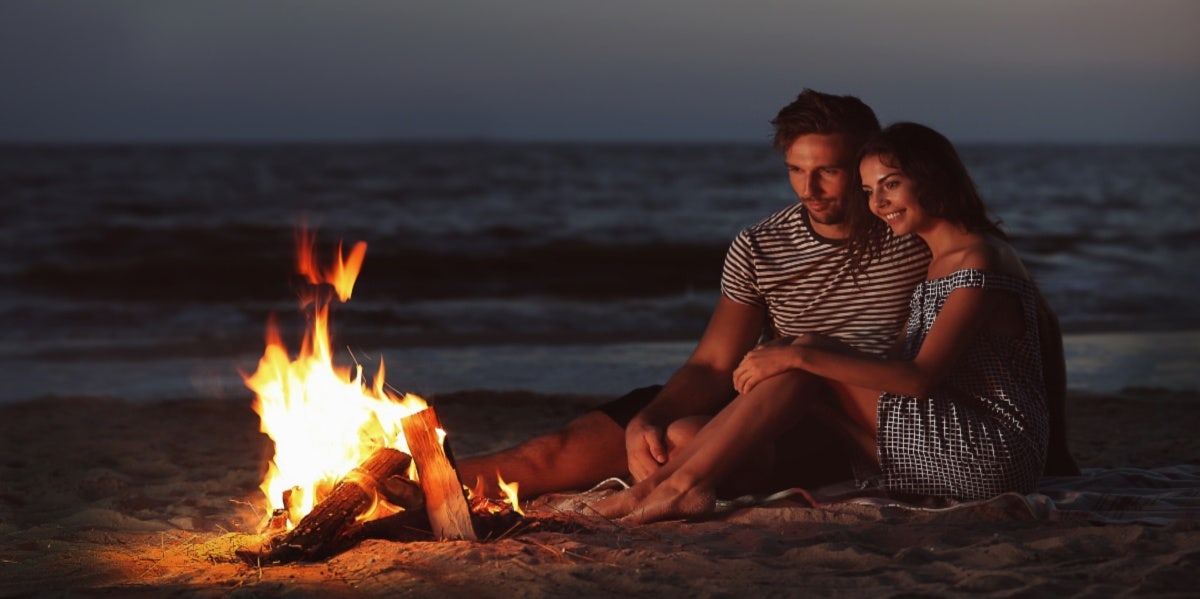 couple by camp fire