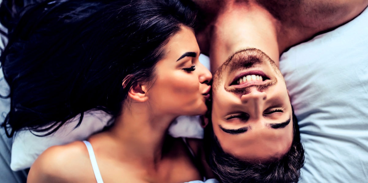 man and woman in bed