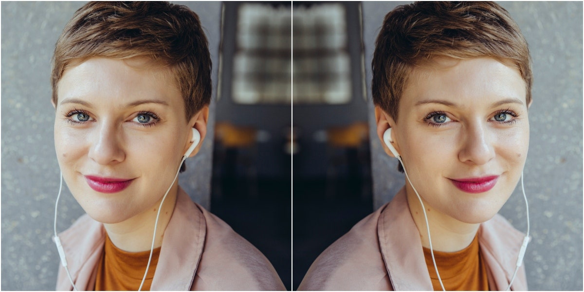 mirrored image of professional-looking woman wearing headphones