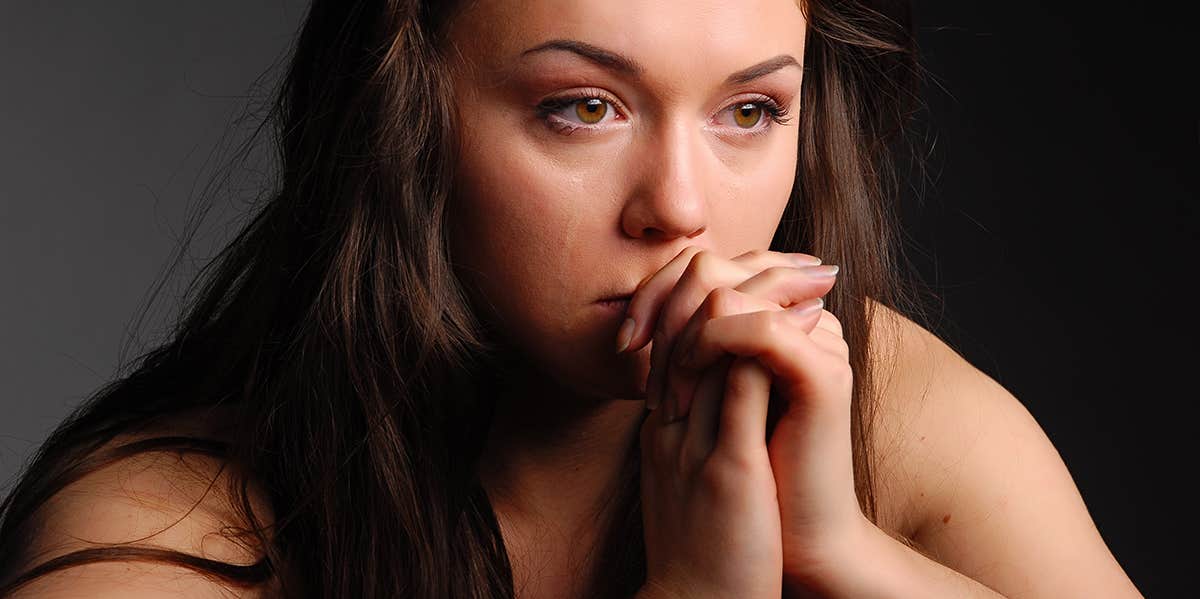 sad woman praying