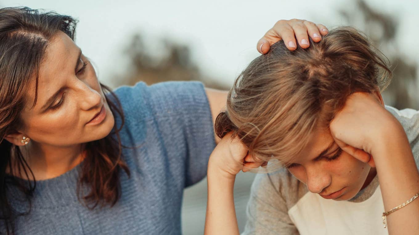 mom comforting upset son