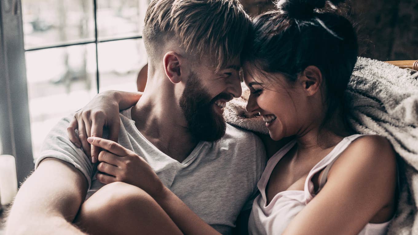 German Shepherd husband and wife embracing