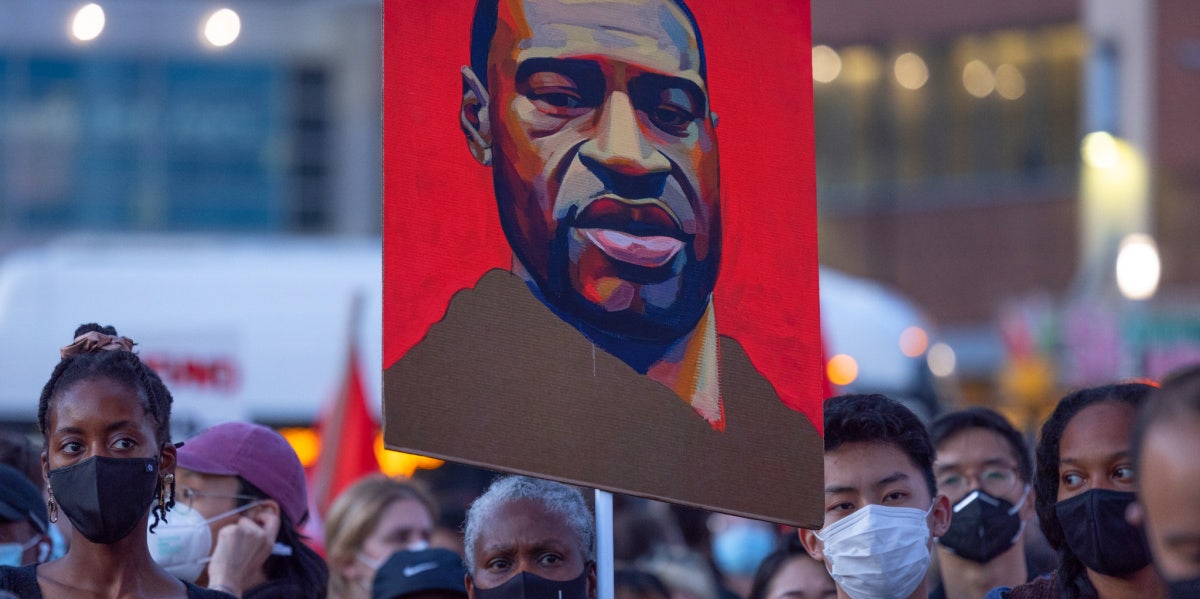 protestors await chauvin verdict, carrying a painting of george floyd