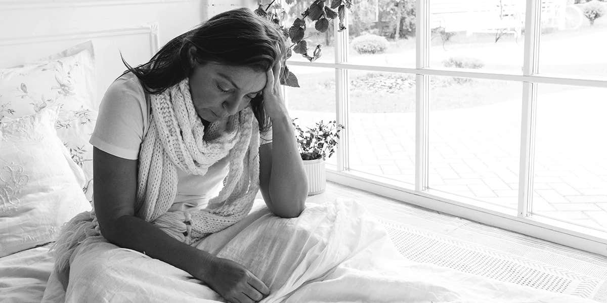 My Chemical Pregnancy Was Still A Miscarriage — And Worthy Of Mourning sad woman in bed