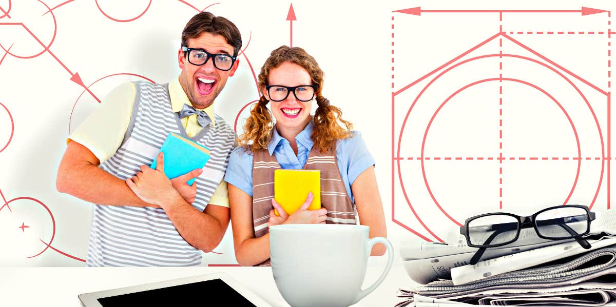 Factors That Cause Chemistry Between People geeky hipster couple holding books and smiling at camera against blueprint