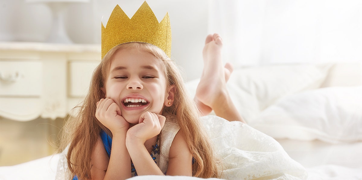 toddler girl with crown on head