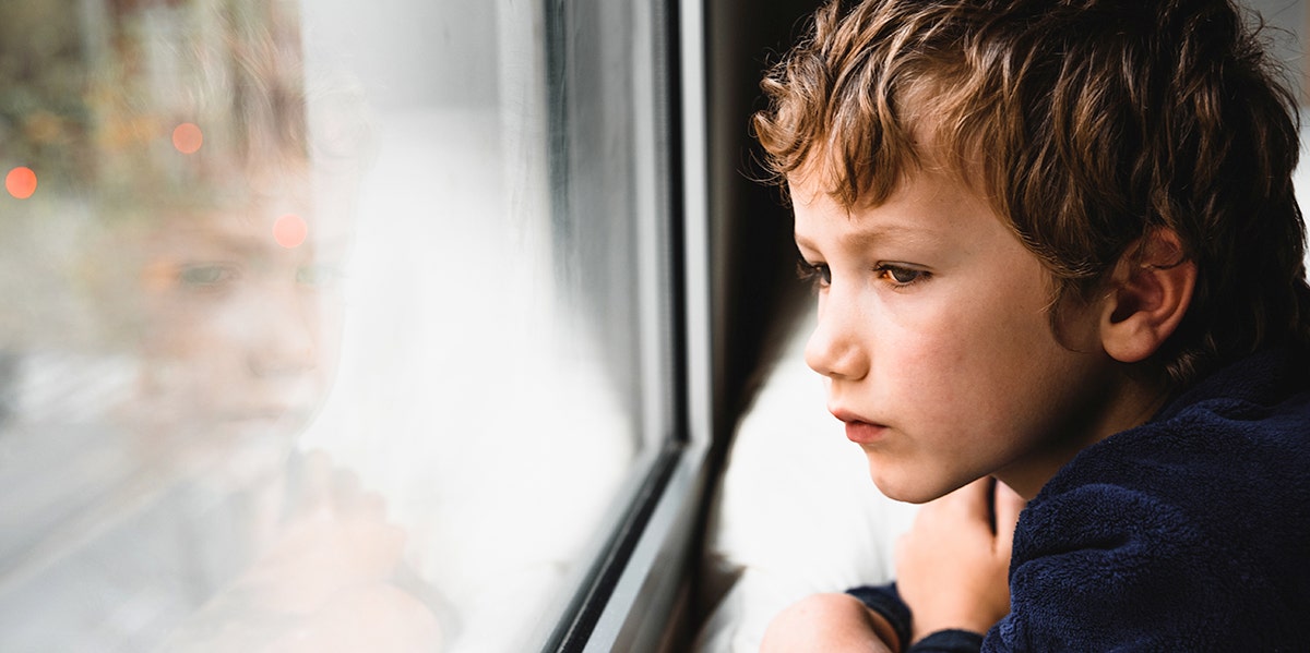 child looking out window