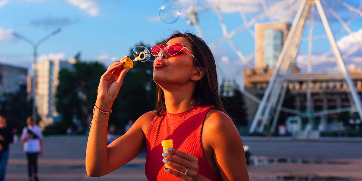 Childlike Things Grown Adults Can Do Daily To Build Inner Peace young girl blowing bubbles
