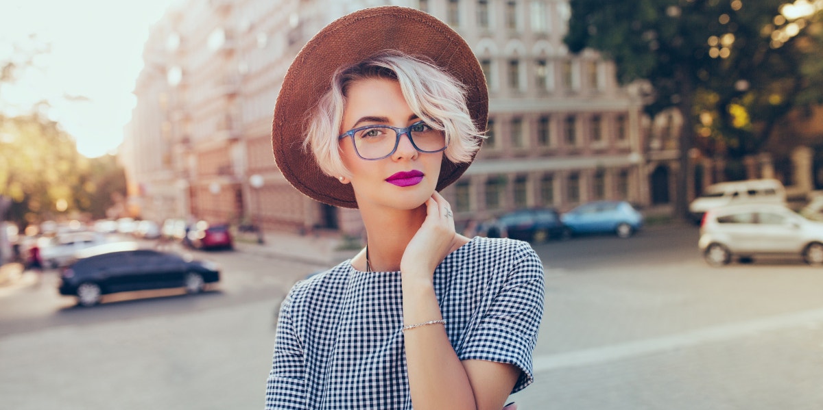 woman with short hair in a hat