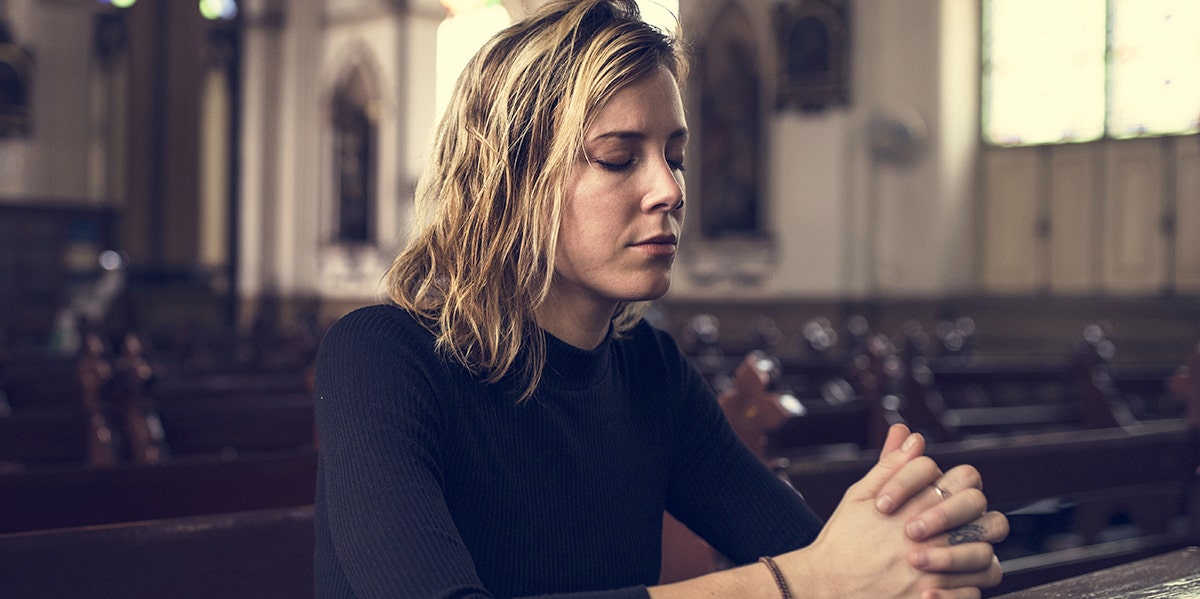 woman praying at church
