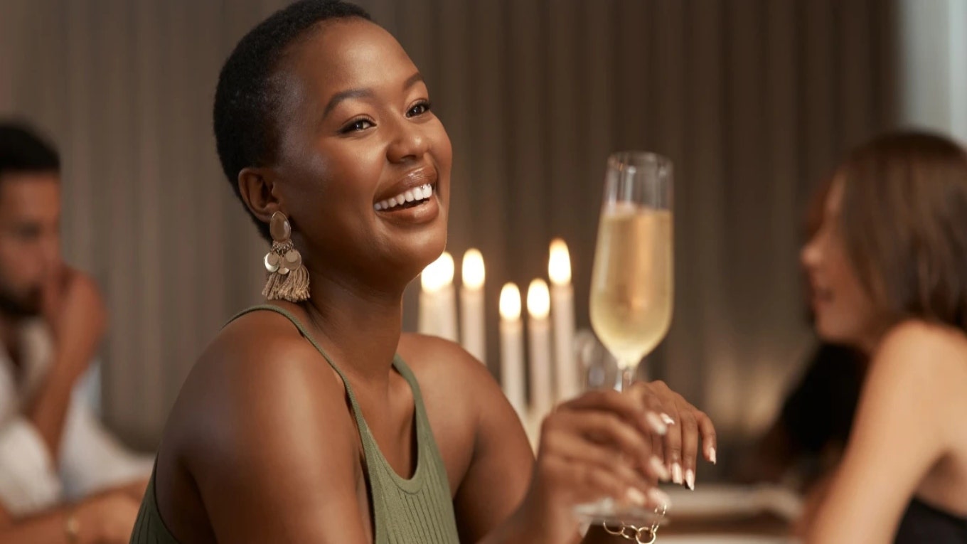 woman cheers wine glass