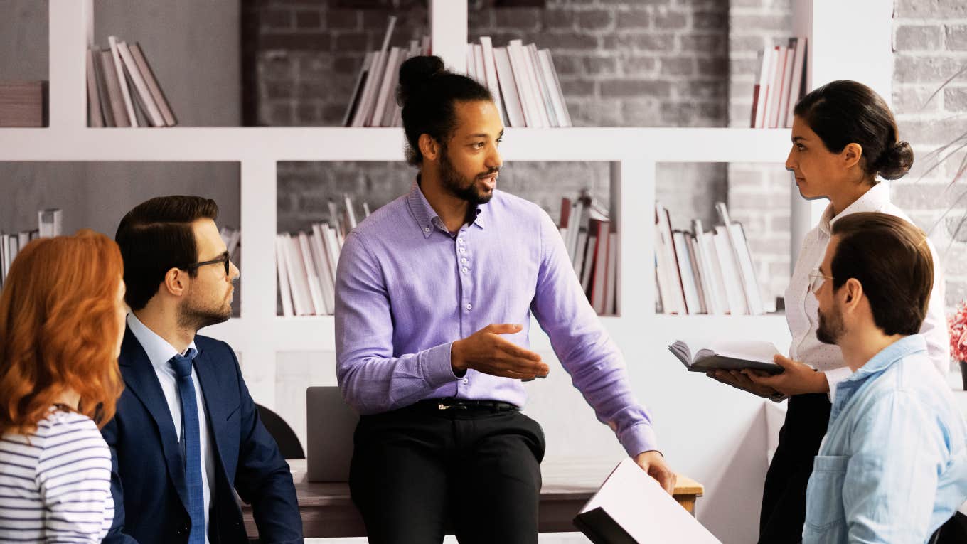 Man talking to employees