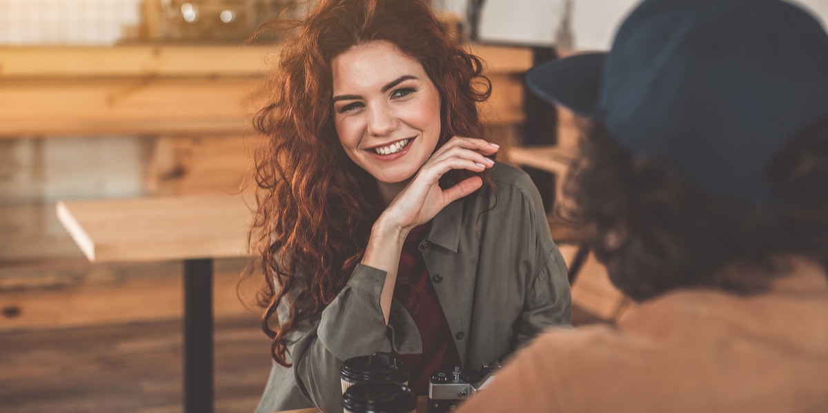 7 Clever Ways To Win Anyone Over In Just One Minute, According To Experts flirting woman on date
