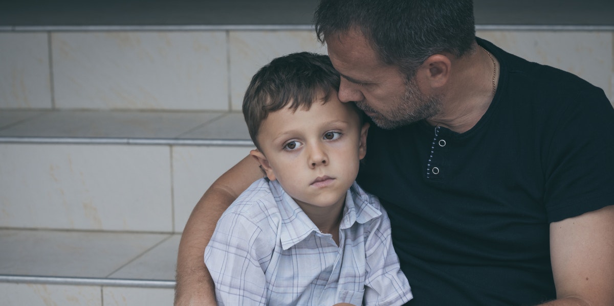 grieving father and son