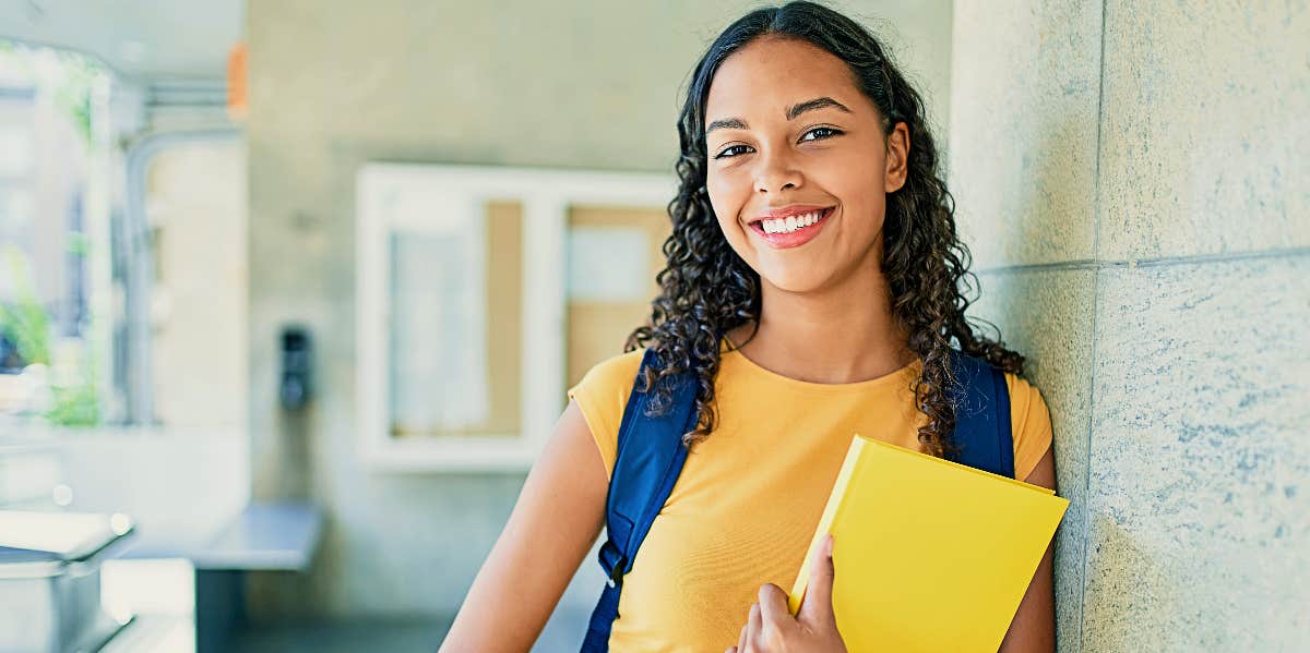 Content college student in yellow