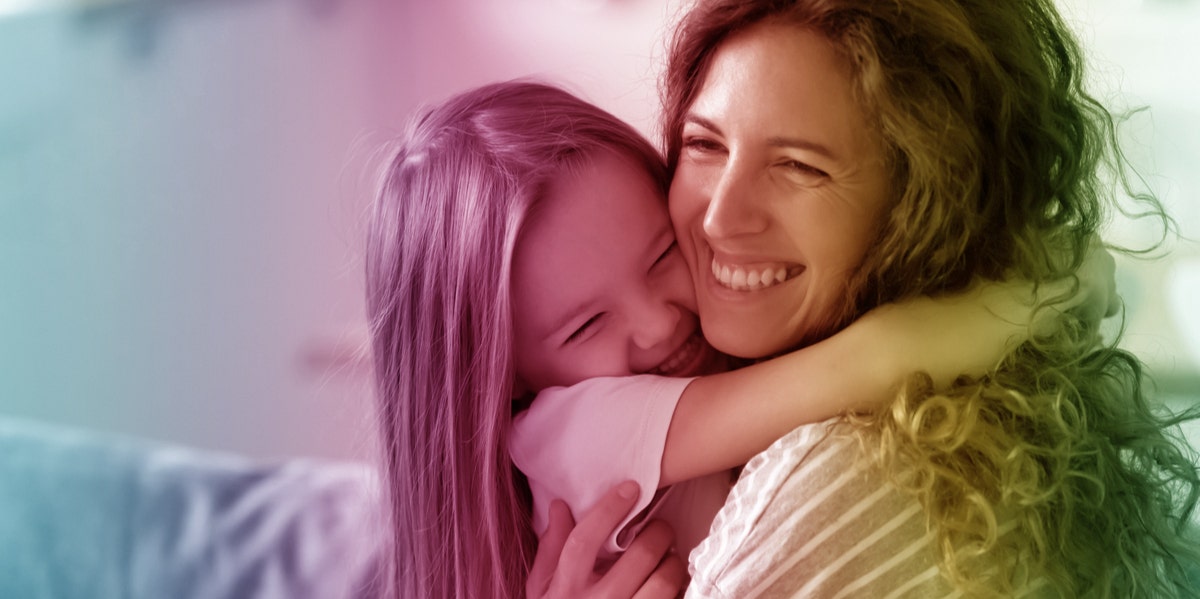 mom hugging daughter