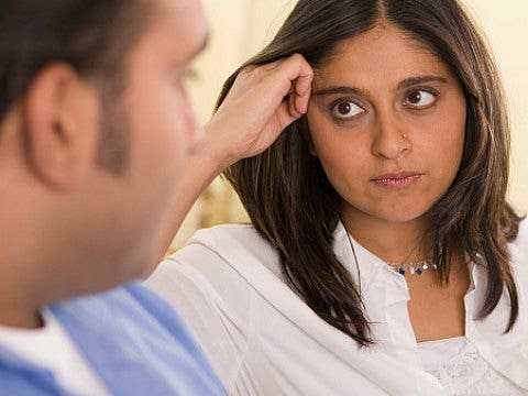 woman looking seriously at man