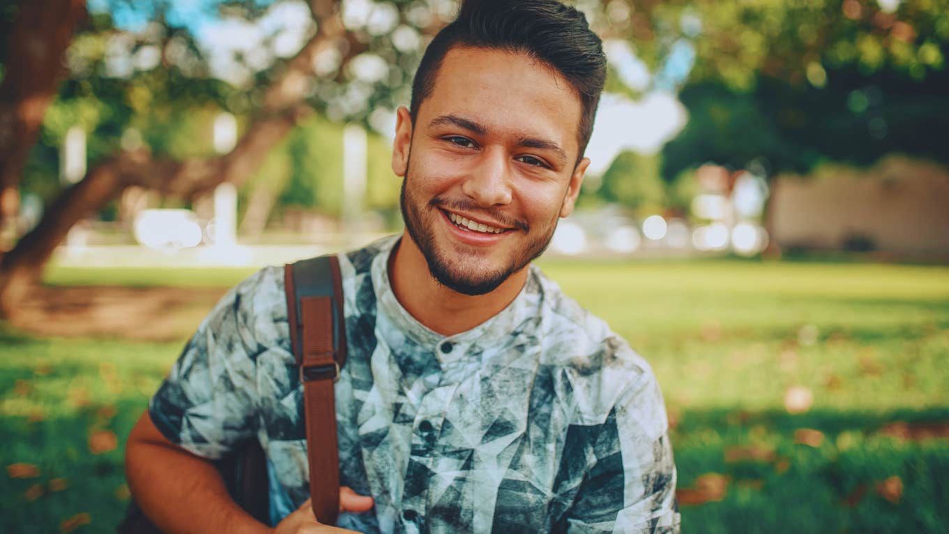 5 Very Common (But Highly Unhealthy) Psychological Habits That Hold People Back In Life man outside smiling